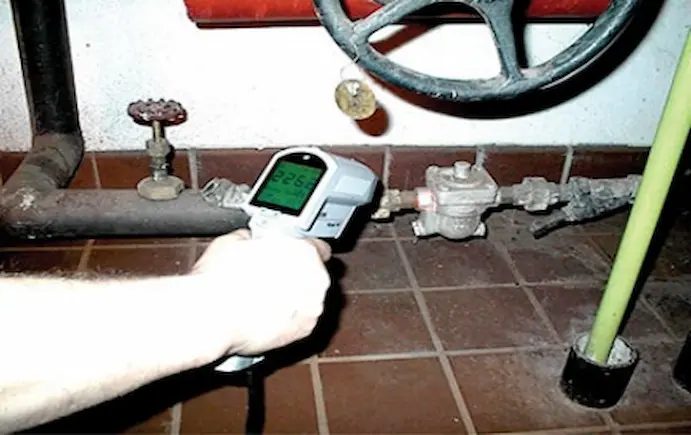 Checking steam trap performance during routine inspection.