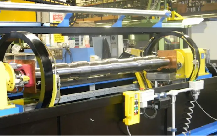 MPI inspection setup for testing valve components in a manufacturing facility.