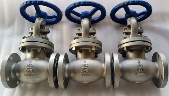 Three flanged cast steel valves with blue handwheels, typical cast valve design for general industrial use Three flanged cast steel valves with blue handwheels, typical cast valve design for general industrial use