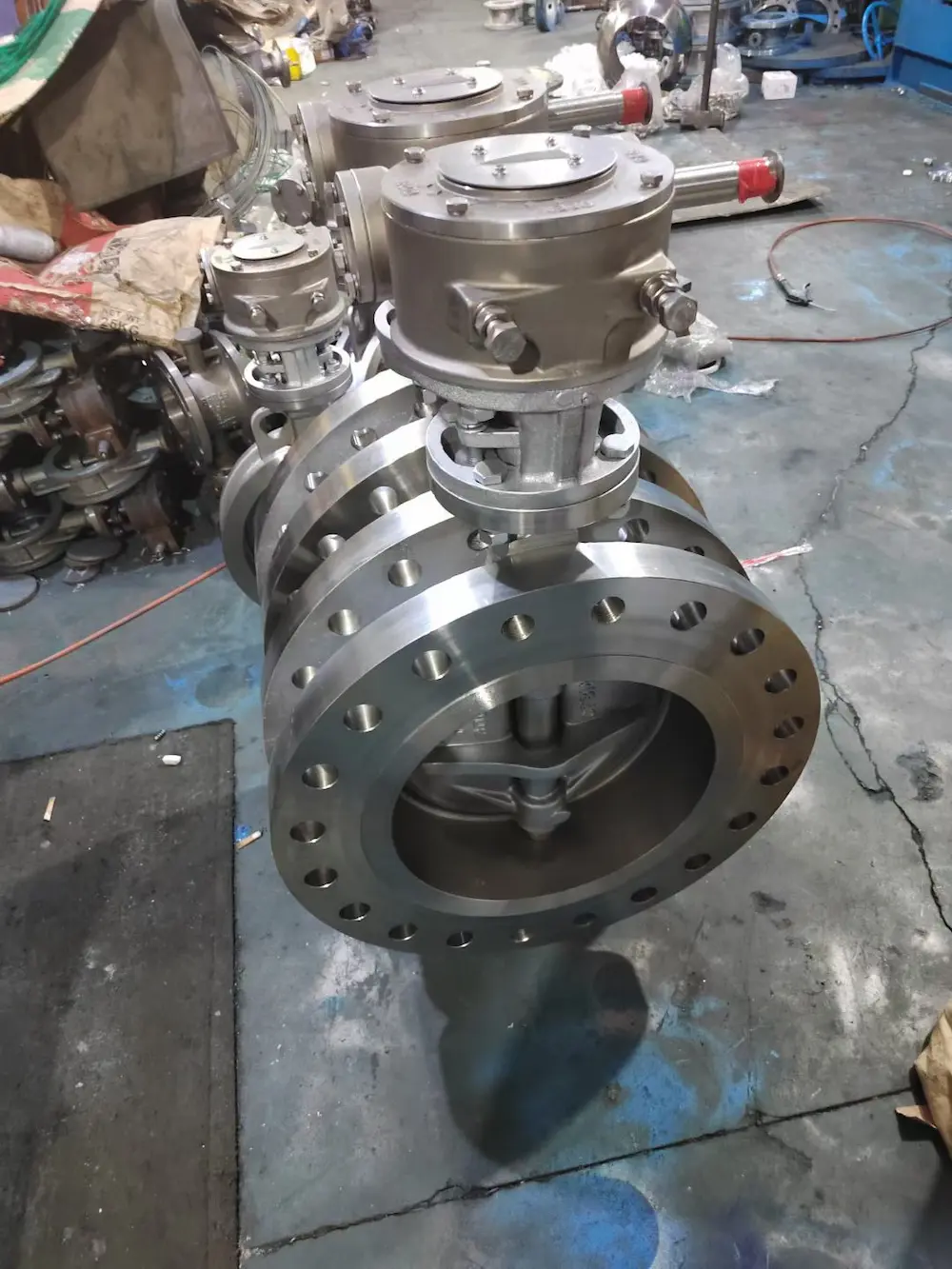 Flanged metal seated butterfly valve with machined flange faces and top-mounted actuator during factory assembly – Vcore Valve